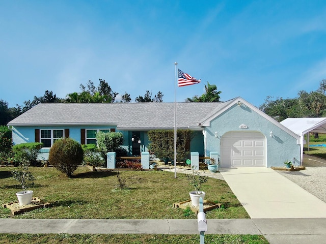 ranch-style house featuring a front lawn and a garage