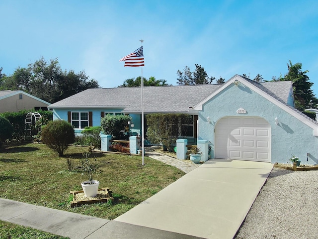 ranch-style house with a front yard and a garage