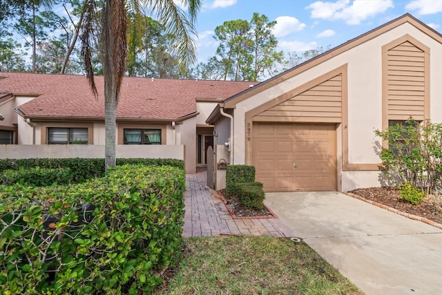 ranch-style house featuring a garage