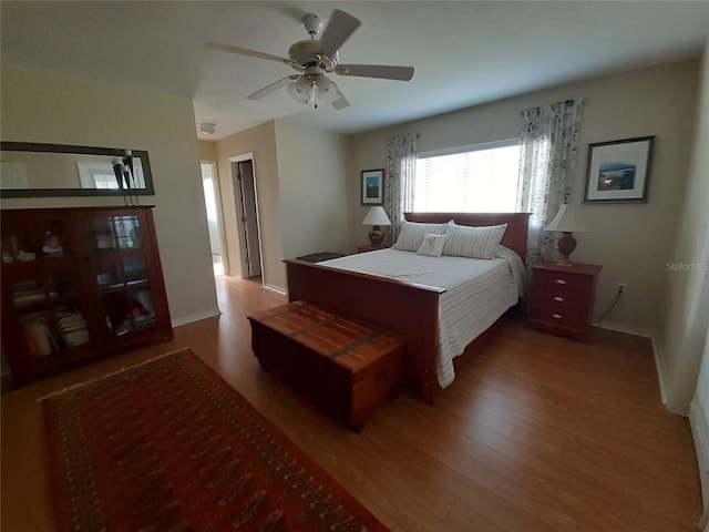 bedroom featuring ceiling fan and hardwood / wood-style floors