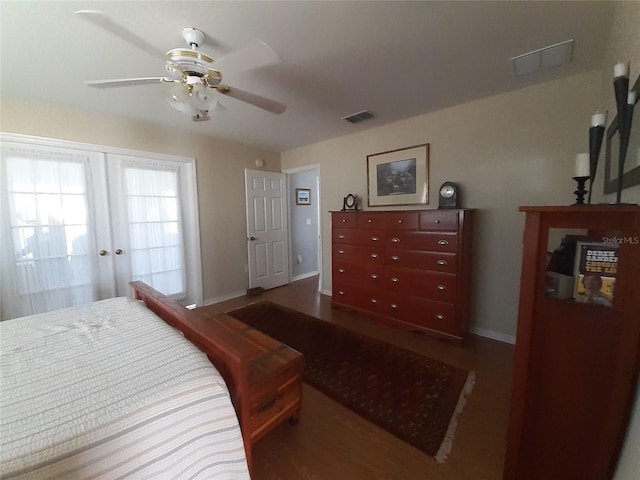 bedroom featuring ceiling fan, french doors, and dark hardwood / wood-style floors