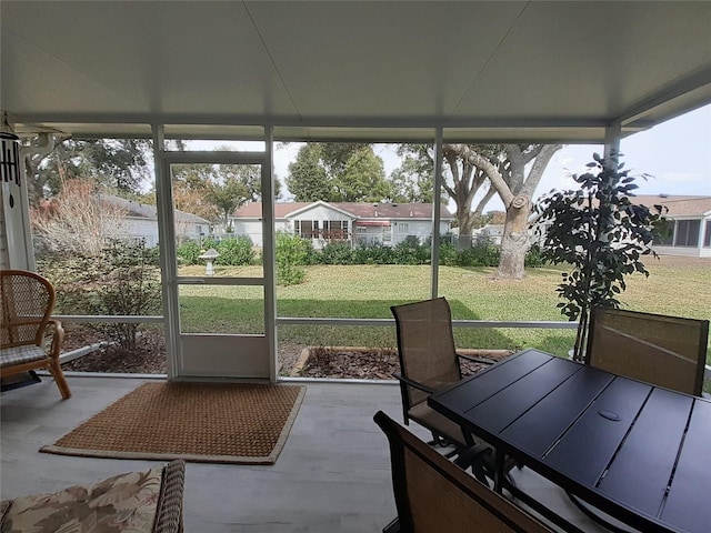 sunroom / solarium featuring a healthy amount of sunlight