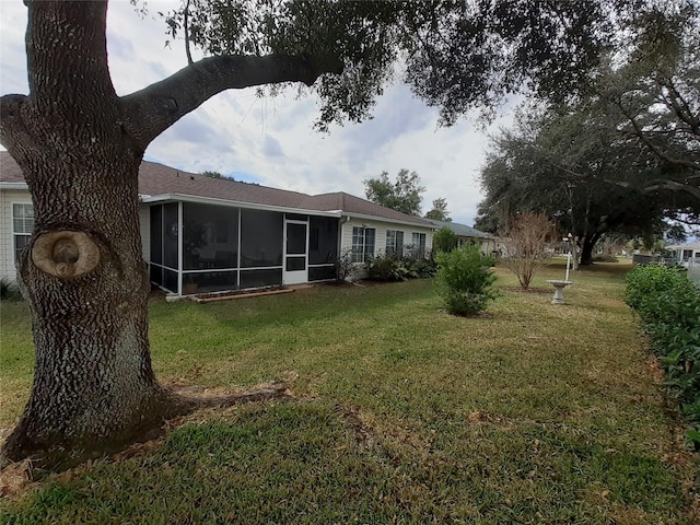 view of yard featuring a sunroom