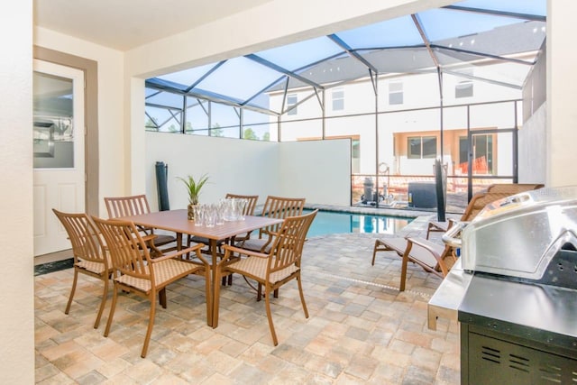 view of patio featuring a lanai