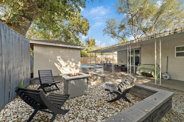 view of patio / terrace featuring a fire pit