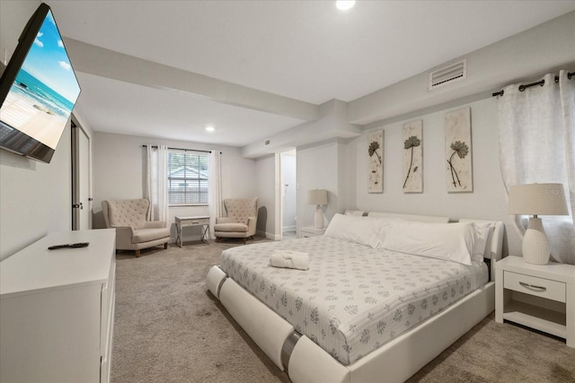 bedroom featuring light carpet