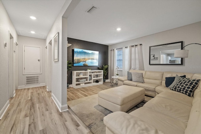 1504 E Mcberry St, Tampa, FL 33610 - living area featuring wood finished floors, baseboards, and visible vents
