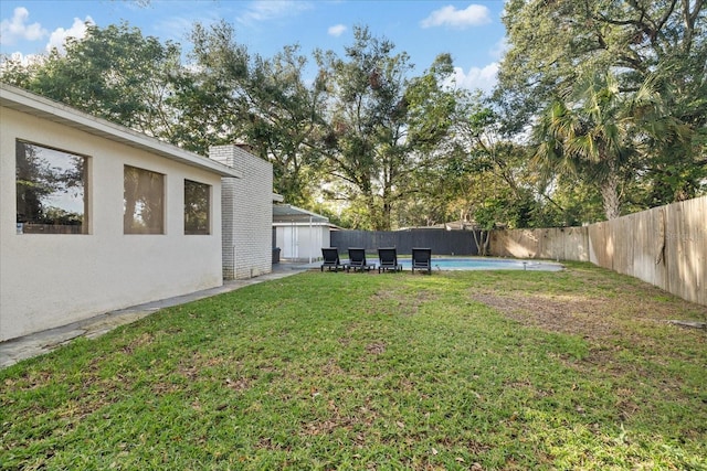 1504 E Mcberry St, Tampa, FL 33610 - view of yard featuring a patio, a fenced in pool, and a fenced backyard