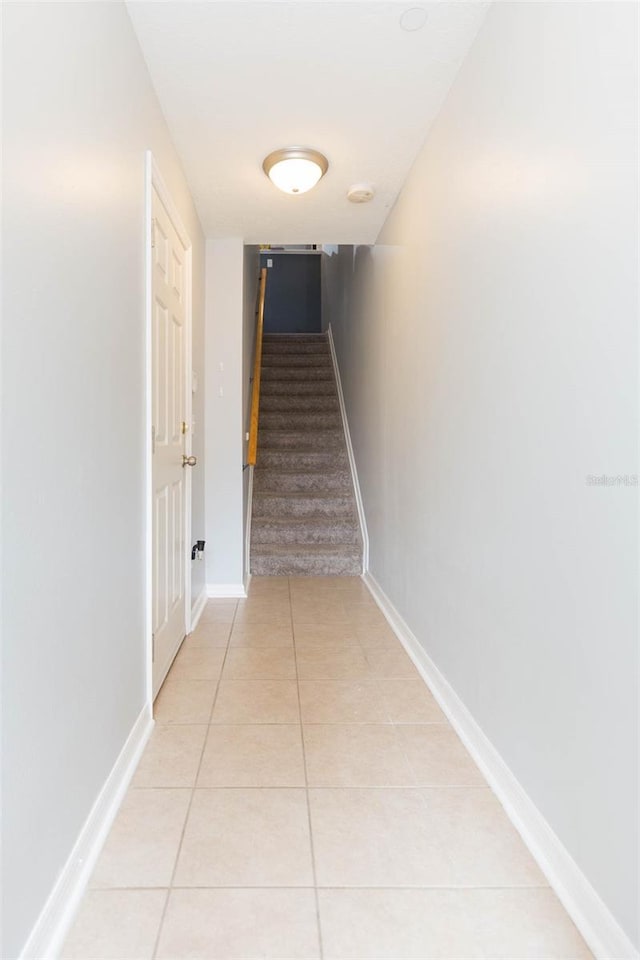 corridor featuring light tile patterned flooring