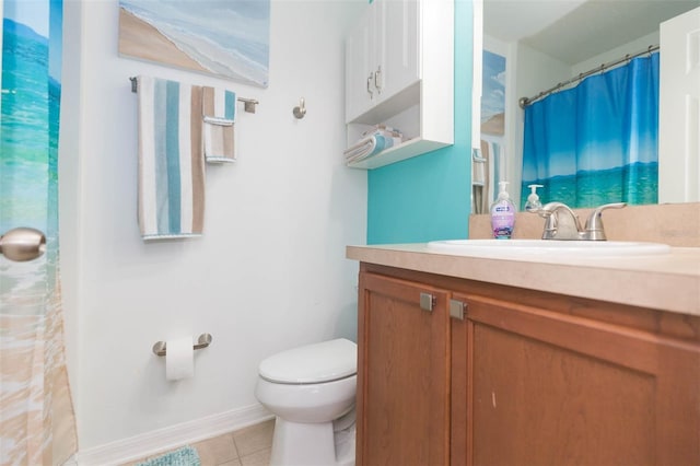 bathroom with tile patterned floors, vanity, and toilet