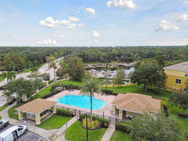 view of swimming pool with a water view