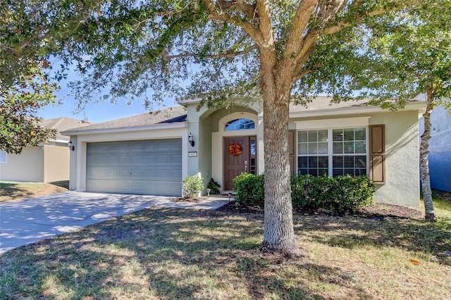 ranch-style house featuring a garage