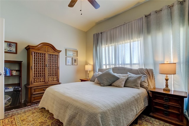 bedroom featuring ceiling fan and vaulted ceiling