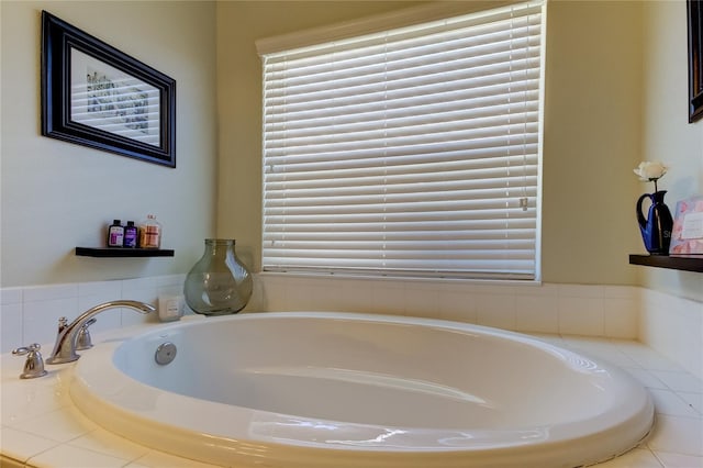 bathroom with a relaxing tiled tub