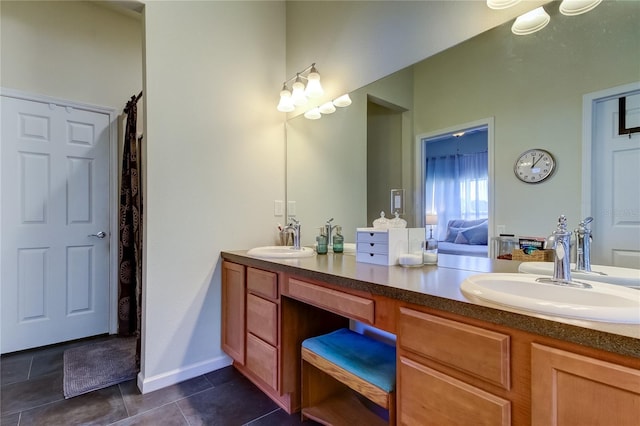 bathroom with tile patterned floors and vanity