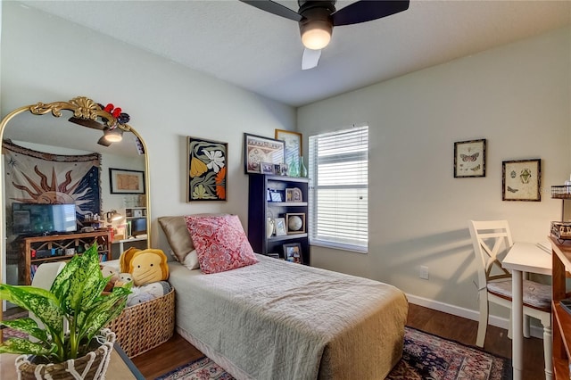 bedroom featuring hardwood / wood-style floors and ceiling fan