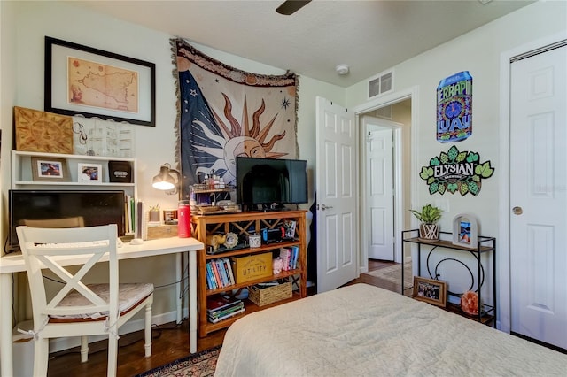 bedroom featuring a closet, ceiling fan, and hardwood / wood-style floors