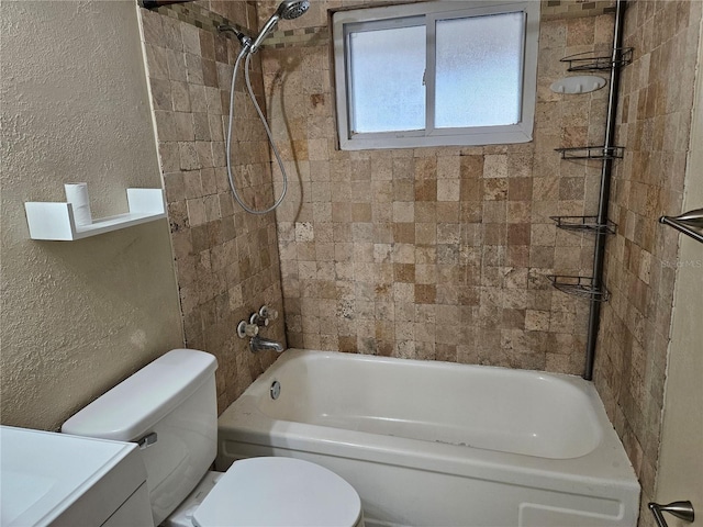 full bathroom featuring vanity, toilet, and tiled shower / bath combo