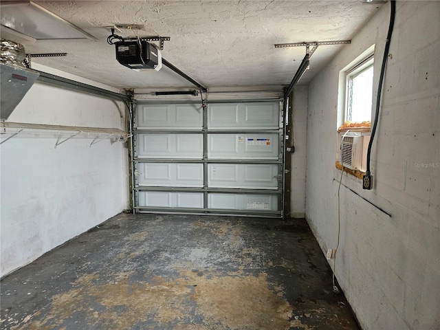 garage featuring a garage door opener and cooling unit