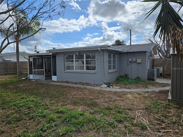 back of house with a sunroom