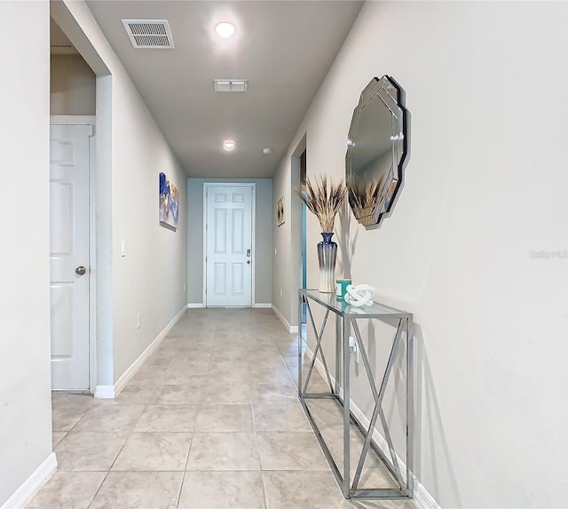 hallway featuring light tile patterned flooring