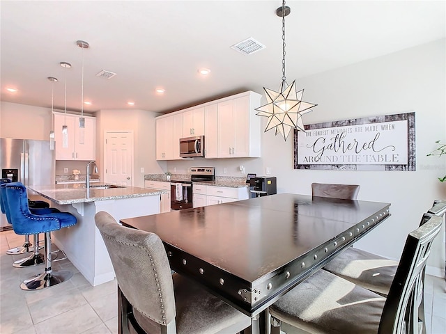 tiled dining area with sink