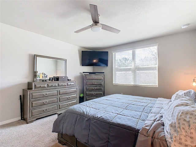 bedroom featuring ceiling fan and light colored carpet