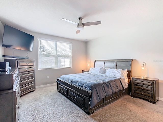 bedroom featuring ceiling fan and light carpet