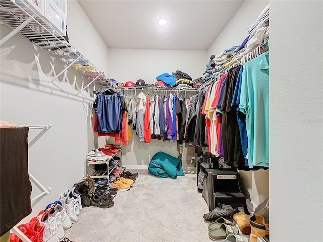 walk in closet featuring carpet