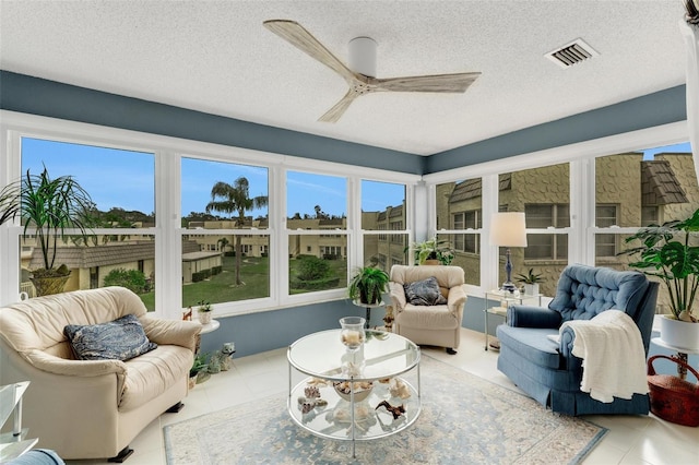 sunroom / solarium with ceiling fan and a healthy amount of sunlight