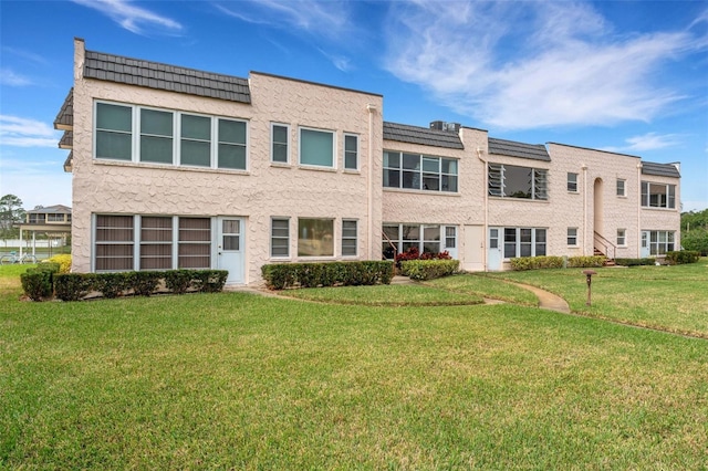 exterior space with a front yard