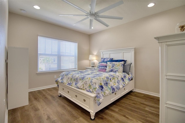 bedroom with ceiling fan and dark wood-type flooring