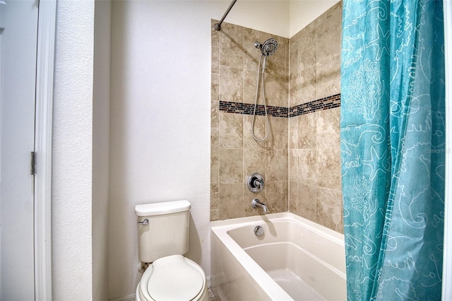 bathroom with toilet and shower / bath combo with shower curtain