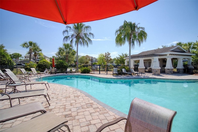 view of swimming pool featuring a patio area