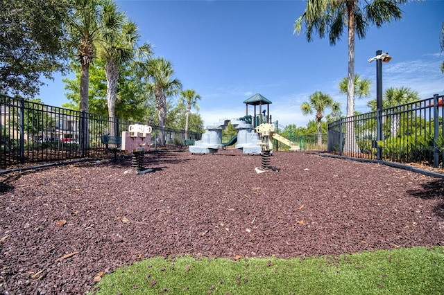 view of property's community with a playground