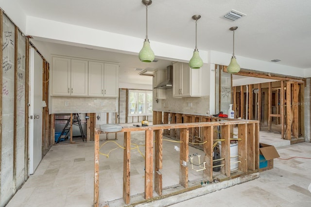 kitchen with backsplash, wall chimney exhaust hood, and decorative light fixtures