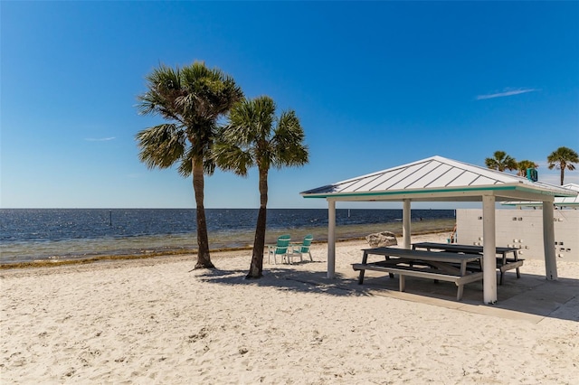 view of home's community with a beach view, a gazebo, and a water view