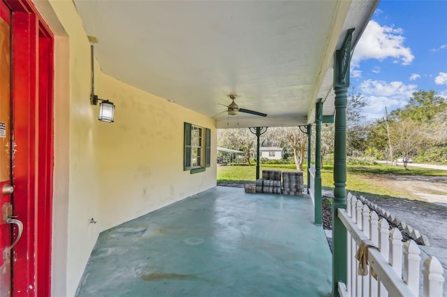 view of patio / terrace with ceiling fan and a porch