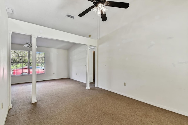 carpeted spare room with vaulted ceiling and ceiling fan