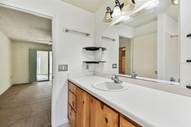 bathroom featuring vanity and ceiling fan