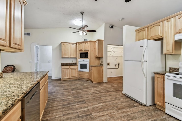 kitchen with ceiling fan, light brown cabinets, dark stone countertops, lofted ceiling, and white appliances