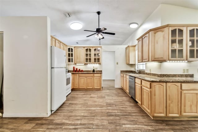 kitchen with light brown cabinets, stainless steel dishwasher, stove, white fridge, and dark stone counters