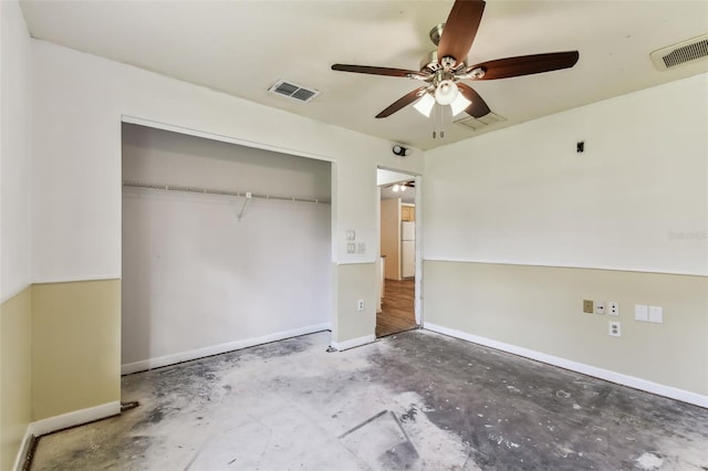 unfurnished bedroom with concrete floors, a closet, and ceiling fan