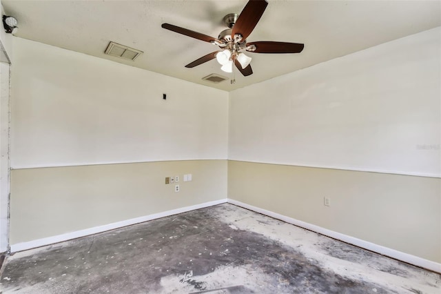 unfurnished room featuring ceiling fan and concrete flooring