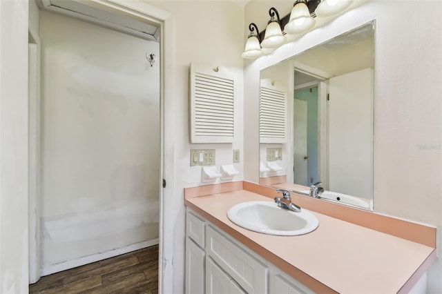 bathroom featuring vanity and wood-type flooring