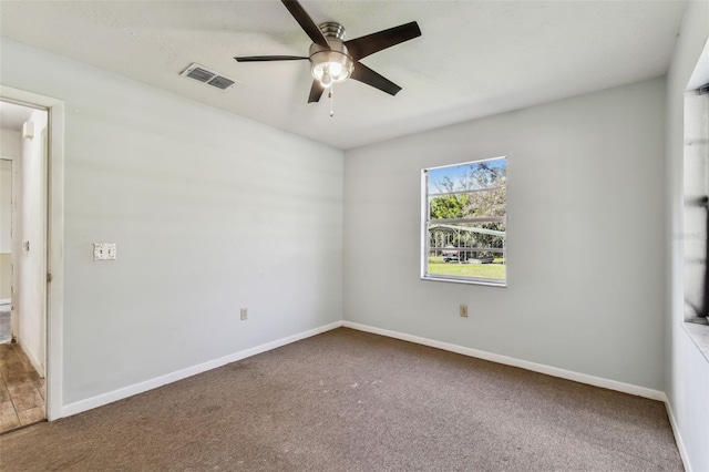 unfurnished room with carpet flooring and ceiling fan