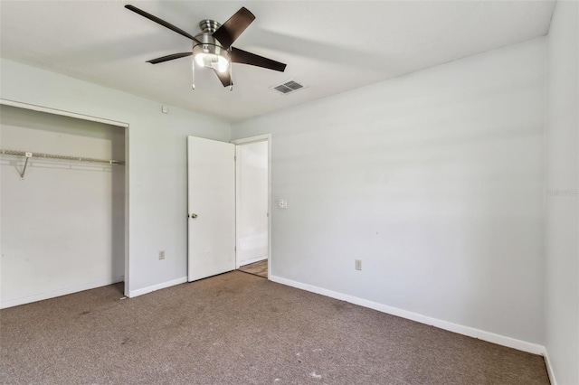 unfurnished bedroom featuring carpet flooring, a closet, and ceiling fan