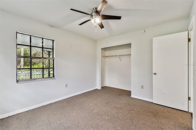 unfurnished bedroom with ceiling fan, carpet floors, and a closet