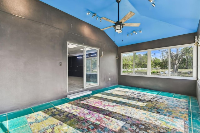 unfurnished bedroom featuring tile patterned floors, ceiling fan, and lofted ceiling