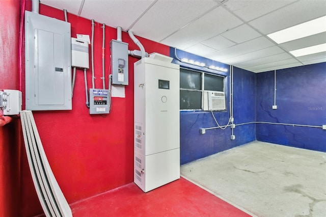 basement with electric panel, a drop ceiling, and cooling unit